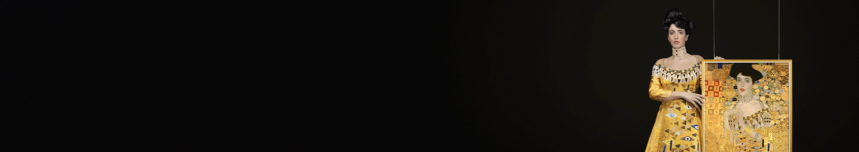 Campaign imagery of lookalike model holding Klimt portrait of The Lady in Gold